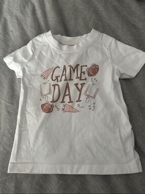 Caden Lane White Toddler Tee with Blush Game Day Football Print